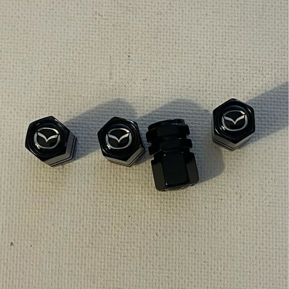 Mazda valve Stem caps in Black set of 4 NWT - Picture 1 of 4